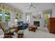 Comfortable living room with a fireplace, large windows, and neutral decor at 200 Frenchmans Bluff Dr, Cary, NC 27513