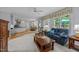 Spacious living room with hardwood floors, open to the kitchen and dining area at 200 Frenchmans Bluff Dr, Cary, NC 27513