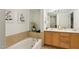 Bright bathroom features a soaking tub and double vanity at 200 S Dawson St # 114, Raleigh, NC 27601