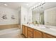 Bright bathroom features a soaking tub and double vanity at 200 S Dawson St # 114, Raleigh, NC 27601