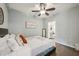 Comfortable bedroom with closet and view to ensuite bathroom at 200 S Dawson St # 114, Raleigh, NC 27601