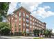 Beautiful brick condo building with large windows and small balconies at 200 S Dawson St # 114, Raleigh, NC 27601