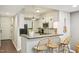 Open kitchen with counter seating and stainless steel appliances at 200 S Dawson St # 114, Raleigh, NC 27601