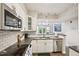Kitchen area has stainless steel appliances and subway tile backsplash at 200 S Dawson St # 114, Raleigh, NC 27601