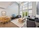 Inviting living room with hardwood floors, high ceilings, and plenty of natural light at 200 S Dawson St # 114, Raleigh, NC 27601