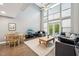 Bright living area with high ceilings, hardwood floors, and floor-to-ceiling windows at 200 S Dawson St # 114, Raleigh, NC 27601