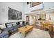 Comfortable living room with hardwood floors and modern decor open to kitchen at 200 S Dawson St # 114, Raleigh, NC 27601