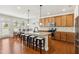Well-appointed kitchen featuring stainless steel appliances, granite countertops, an island and lots of light at 205 Begen St, Morrisville, NC 27560
