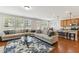 Bright open-concept living room, seamlessly flows into the kitchen with lots of natural light and hardwood flooring at 205 Begen St, Morrisville, NC 27560
