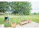 Spacious backyard with a swing set and planters, ideal for outdoor activities and gardening at 2120 Northcrest Dr, Elon, NC 27244