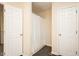 This bathroom features a white shower curtain, wood-look flooring, and two doors for easy access at 2120 Northcrest Dr, Elon, NC 27244