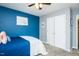 Bedroom features carpet, ceiling fan, and a closet with plenty of natural light for a comfortable and inviting space at 2120 Northcrest Dr, Elon, NC 27244