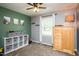 Bedroom features carpet, ceiling fan, and shelving that offers ample space for storage and display at 2120 Northcrest Dr, Elon, NC 27244