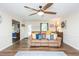 Well-lit living room featuring hardwood floors, a comfortable sofa, and neutral wall colors at 2120 Northcrest Dr, Elon, NC 27244