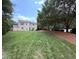 Expansive backyard with well-maintained lawn, mature trees, and potential for outdoor enjoyment at 2228 Cedar Grove Dr, Durham, NC 27703