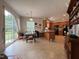 Kitchen with laminate floors and countertops with the dining area and sliding door to the backyard at 2228 Cedar Grove Dr, Durham, NC 27703