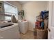Convenient laundry room features washer, dryer, shelving and storage space at 2228 Cedar Grove Dr, Durham, NC 27703
