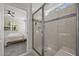 Bathroom featuring a tiled shower with a glass door, offering a blend of style and functionality at 2321 Blue Crab Ct, Wake Forest, NC 27587