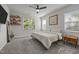 Bright bedroom with lots of light and space, complemented by a ceiling fan and views of the neighborhood at 2321 Blue Crab Ct, Wake Forest, NC 27587