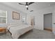 Spacious bedroom with a ceiling fan, plush carpet, and natural light creating a comfortable retreat at 2321 Blue Crab Ct, Wake Forest, NC 27587