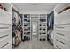 Well-organized walk-in closet with custom shelving and ample storage for clothes, shoes, and accessories at 2321 Blue Crab Ct, Wake Forest, NC 27587