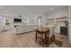 Open-concept living room with fireplace, dining area, wine storage, and modern finishes for comfortable living at 2321 Blue Crab Ct, Wake Forest, NC 27587