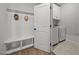 Bright mudroom features a built-in bench with storage and a convenient laundry area with washer and dryer at 2321 Blue Crab Ct, Wake Forest, NC 27587