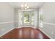 Bright dining room with large windows and modern light fixture at 2409 Valley Haven Dr, Raleigh, NC 27603