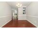 This dining room features wood-look floors and views into the living room and kitchen at 2409 Valley Haven Dr, Raleigh, NC 27603