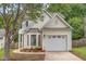 Charming two-story home with a well-manicured lawn and a convenient attached garage at 2409 Valley Haven Dr, Raleigh, NC 27603