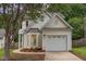Charming home with a front yard, mature trees and an attached one car garage at 2409 Valley Haven Dr, Raleigh, NC 27603