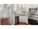 This bright kitchen features stainless steel appliances and granite countertops at 2409 Valley Haven Dr, Raleigh, NC 27603