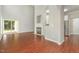 This living room features a fireplace, wood-look floors, and a sliding glass door leading to the backyard at 2409 Valley Haven Dr, Raleigh, NC 27603