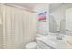 Bright bathroom with a white vanity, toilet, and flamingo shower curtain at 248 Amber Acorn Ave, Raleigh, NC 27603