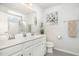Bright bathroom with a double sink vanity, ample counter space, a large mirror, and a walk-in shower at 248 Amber Acorn Ave, Raleigh, NC 27603