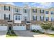 Charming townhome showcasing a brick and siding facade, inviting entrance, and an attached one-car garage at 248 Amber Acorn Ave, Raleigh, NC 27603