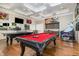 Fun-filled game room featuring a pool table, ping pong, TV, and other games at 248 Amber Acorn Ave, Raleigh, NC 27603