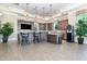 Clubhouse kitchen with bar, sleek appliances, and counter seating at 248 Amber Acorn Ave, Raleigh, NC 27603
