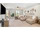 Inviting living room features a decorative wall, plush seating, neutral tones, and ample natural light at 248 Amber Acorn Ave, Raleigh, NC 27603