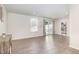 Spacious living area with luxury vinyl plank floors, sliding door, and modern decor at 248 Amber Acorn Ave, Raleigh, NC 27603