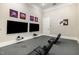 Video game room with two large tv screens and black reclining chairs for comfortable game playing at 248 Amber Acorn Ave, Raleigh, NC 27603