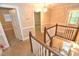 Bright hallway featuring a staircase and multiple doorways, enhancing accessibility at 2708 Coleberry Trl, Rocky Mount, NC 27804