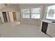 Bright kitchen featuring ample natural light and crisp white cabinetry and flooring at 2708 Coleberry Trl, Rocky Mount, NC 27804