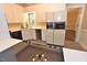 Kitchen featuring ample counter space, white cabinets, and modern appliances with a view to living area at 2708 Coleberry Trl, Rocky Mount, NC 27804