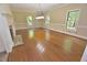 Spacious living room with hardwood floors, fireplace, three windows and neutral color palette at 2708 Coleberry Trl, Rocky Mount, NC 27804