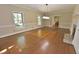 Spacious living room with hardwood floors, fireplace, two windows and neutral color palette at 2708 Coleberry Trl, Rocky Mount, NC 27804
