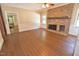 Living room with brick fireplace, abundant natural light, and open access to other rooms at 2708 Coleberry Trl, Rocky Mount, NC 27804