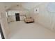 Bright living space above garage features a bed, mini kitchen, and vaulted ceilings at 2708 Coleberry Trl, Rocky Mount, NC 27804