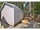 Outbuilding with ramp situated on a lot with mature trees and asphalt driveway at 2708 Coleberry Trl, Rocky Mount, NC 27804