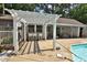 Outdoor patio featuring a pergola with bar seating perfect for entertaining next to the pool at 2708 Coleberry Trl, Rocky Mount, NC 27804